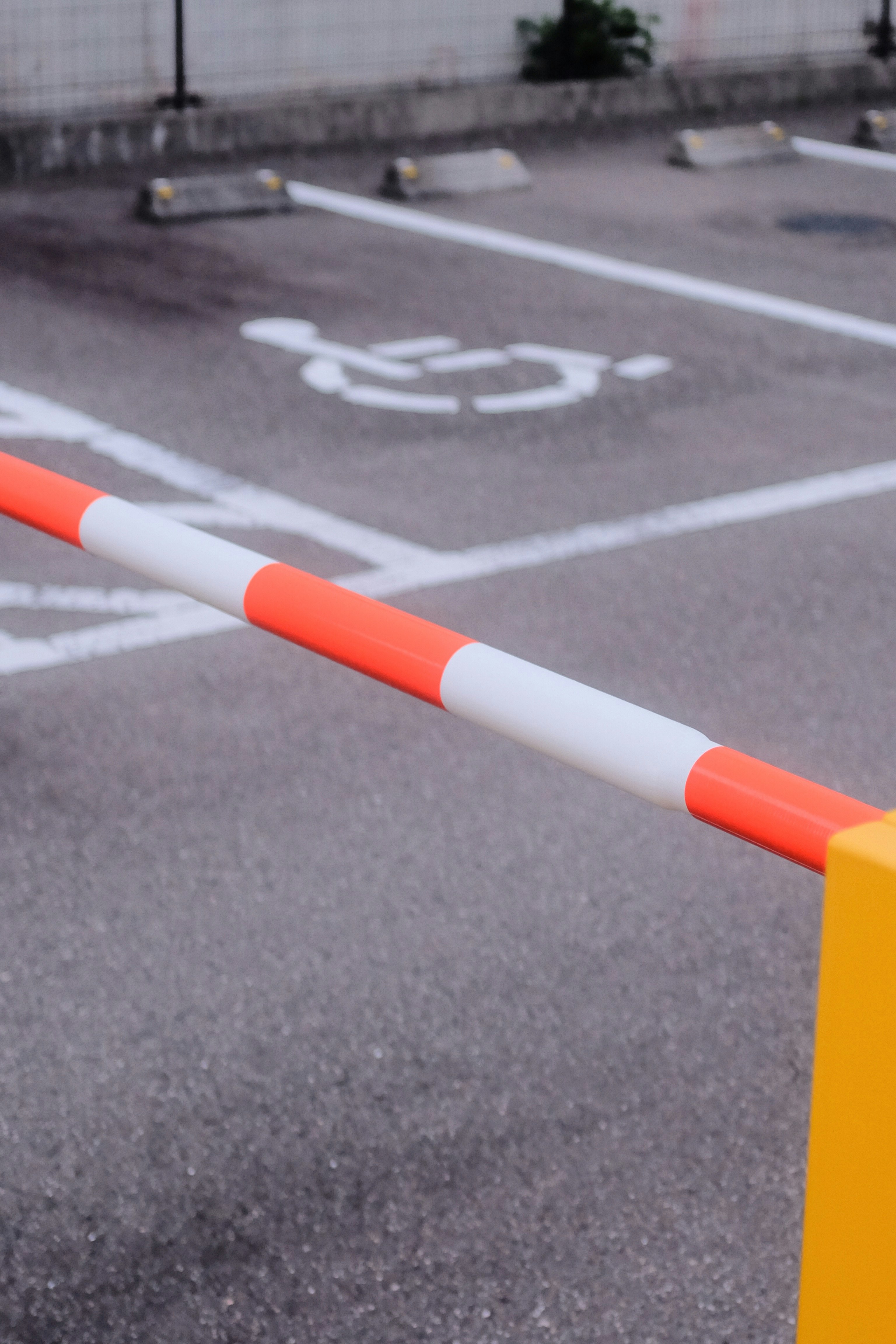 white and orange rod on gray concrete road